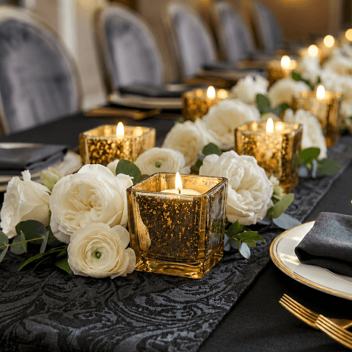 Metallic gold mercury square votive holders with white floral table centerpiece decor
