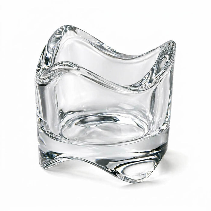 Clear glass swirl-top votive and tealight holder on a white background