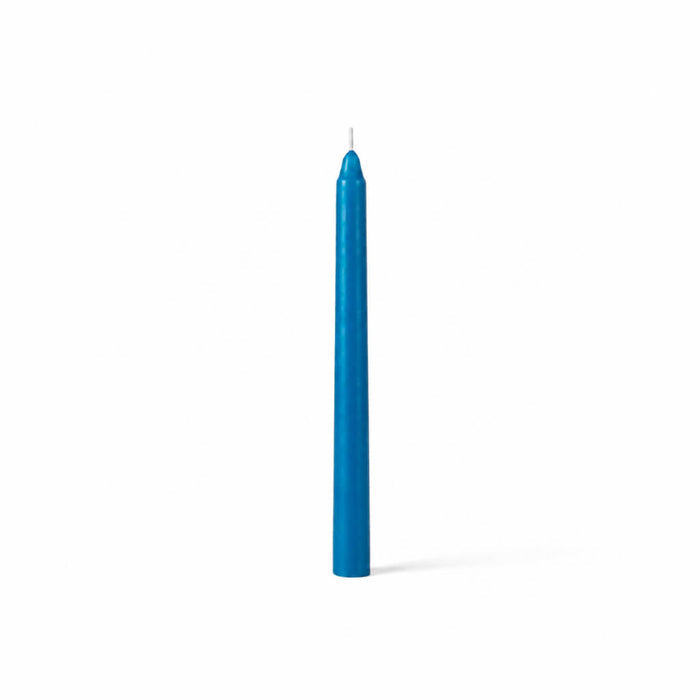 Unlit blue taper candle standing on white background