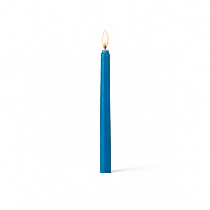 Lit blue taper candle isolated on white background