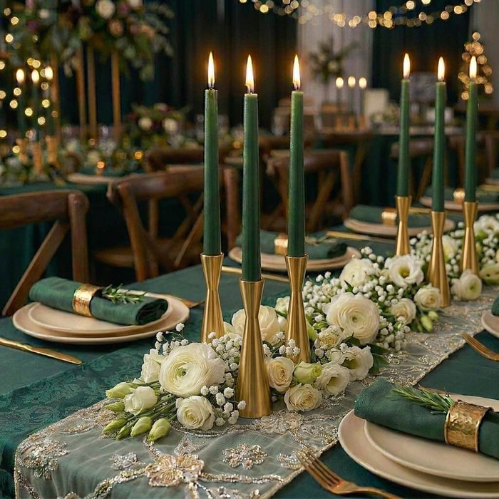Elegant tablescape with green taper candles and white floral centerpiece