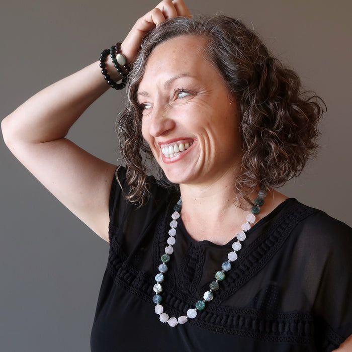 woman modeling a rose quartz moss agate flower necklace