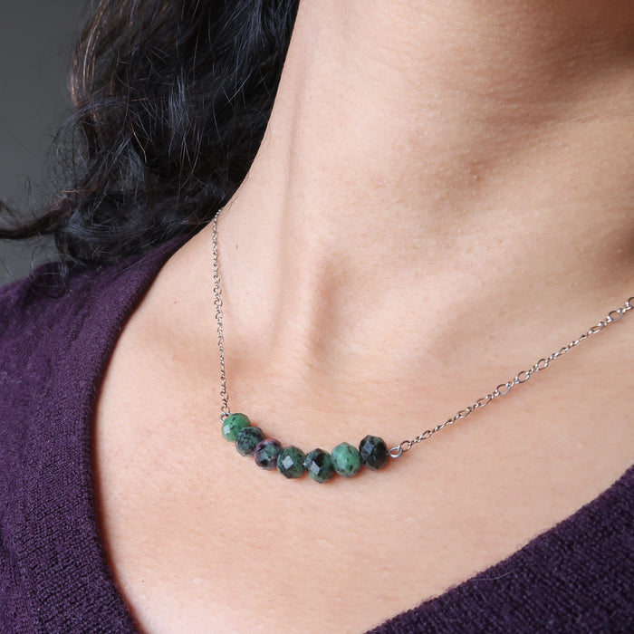 female wearing ruby zoisite necklace