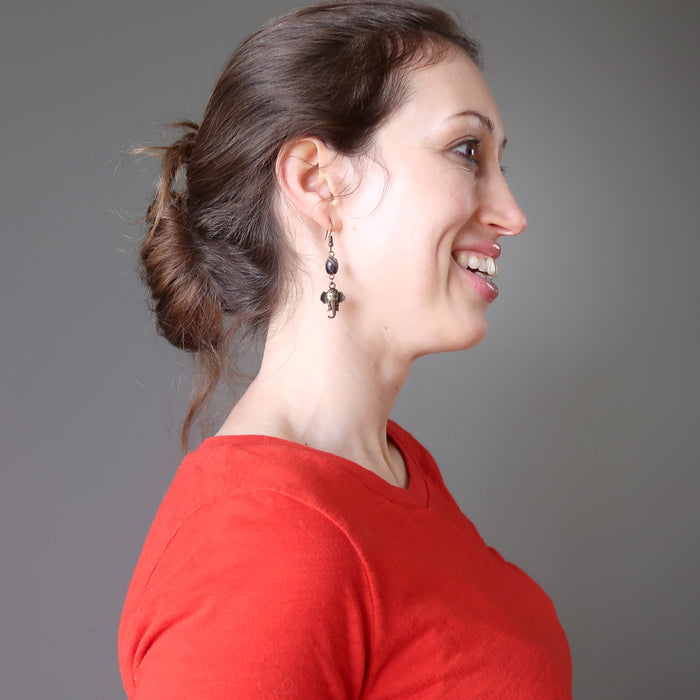 female model wearing sardonyx elephant earrings