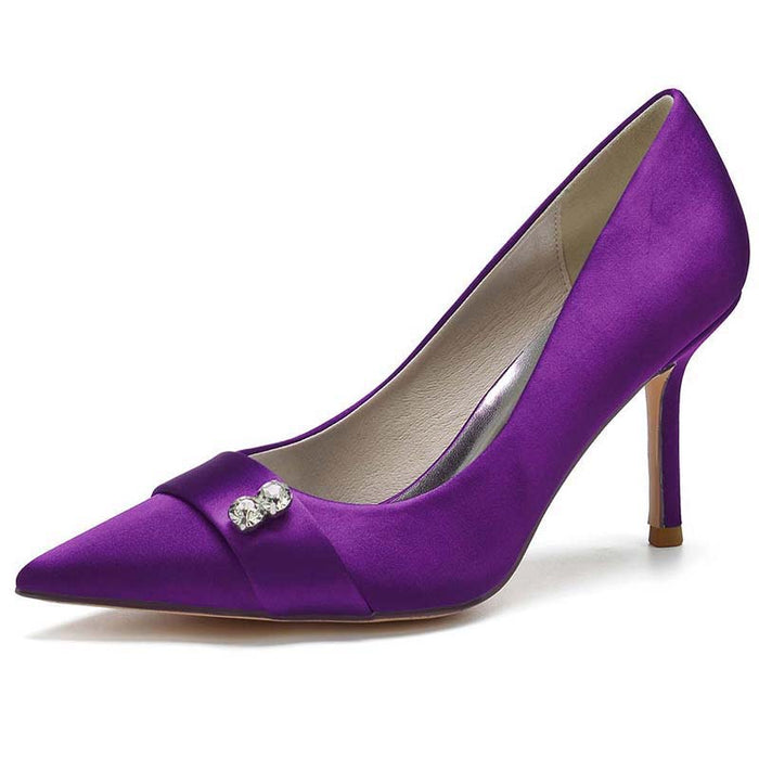 Purple high-heeled shoe with a decorative bow on a white background