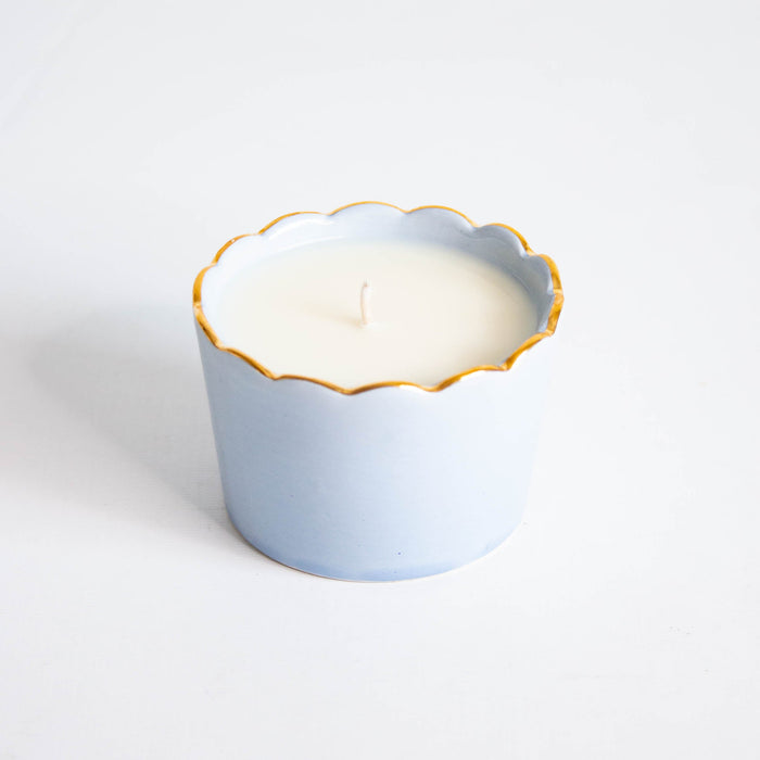 Scallop Soy Candle Cup in Gold-Luster Stoneware — French Blue Scallop Candle Cup with Gold-luster rim and visible wick; Susan Gordon Pottery
