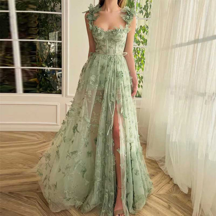 Elegant butterfly tulle prom dress in light green with flower appliques and a thigh-high slit