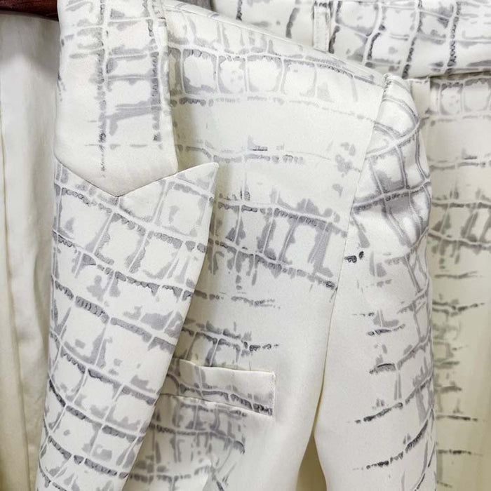 Ivory animal print suit for women featuring a stylish pattern and tailored design