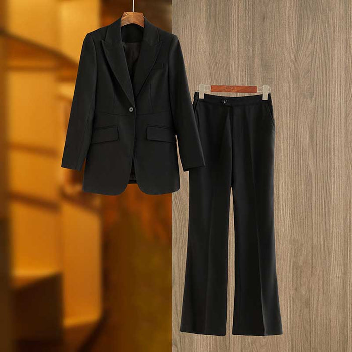 Elegant professional women's black suit for events featuring a tailored blazer and matching trousers
