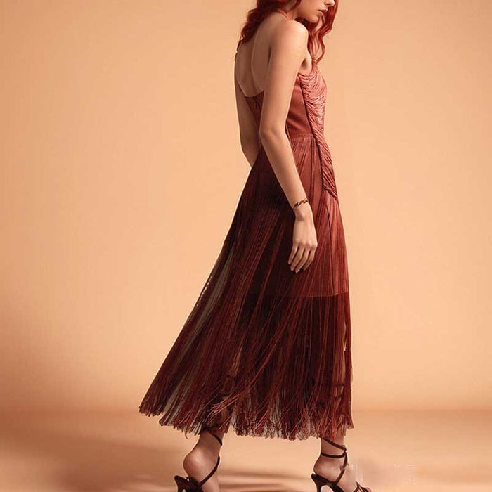 Strappy bodycon dress with tassel details in a flowing design perfect for special occasions