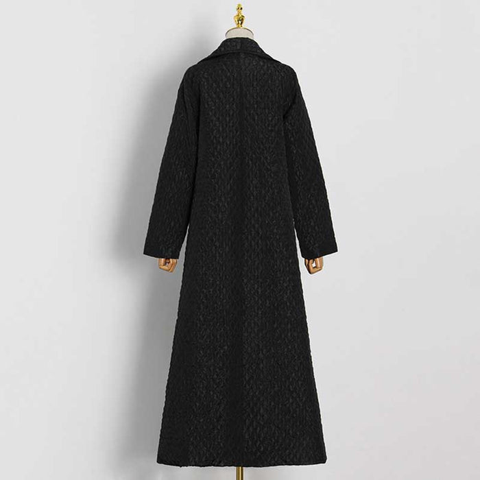 Back view of an oversized black winter jacket for women with long sleeves and a stylish design