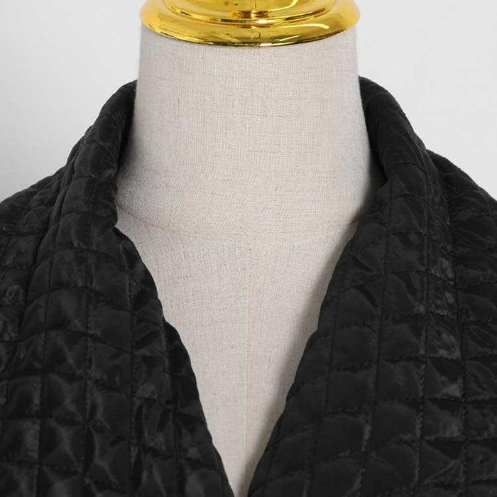 Cozy oversized black winter jacket for women with quilted details and a stylish collar