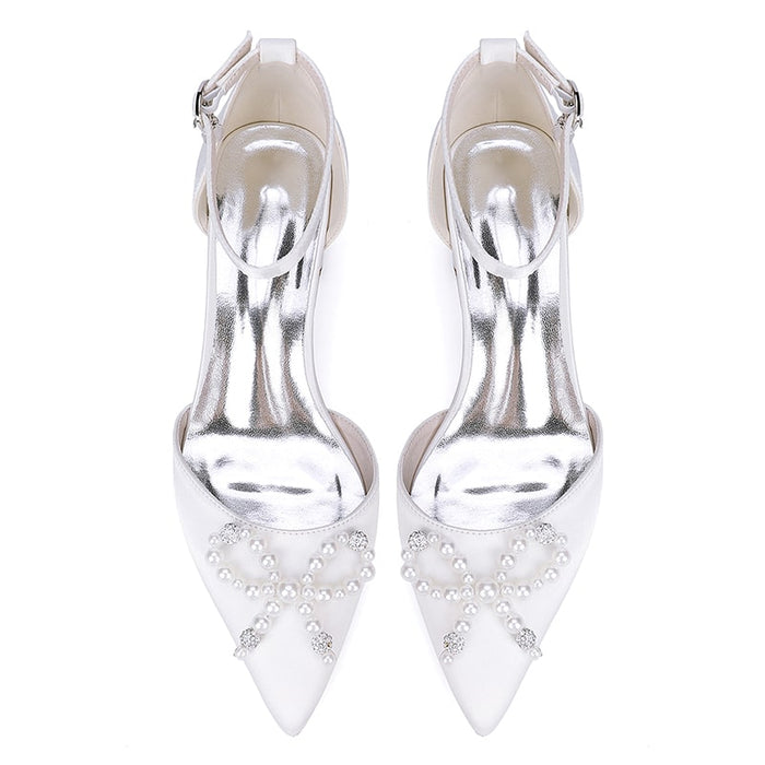 Elegant satin bridal flats with a pointed toe and pearl embellishments, perfect for weddings