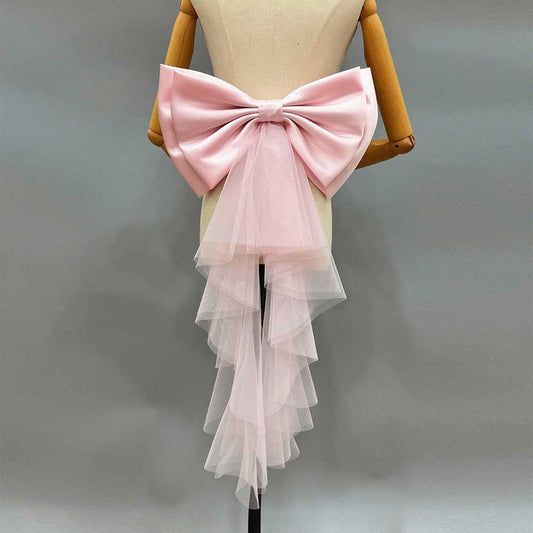 Satin wedding bow for bridal dress in pink with tulle overlay and cascading design
