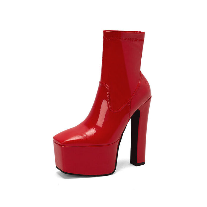 Red women's platform ankle boots with a glossy finish and high chunky heel for stylish outfits