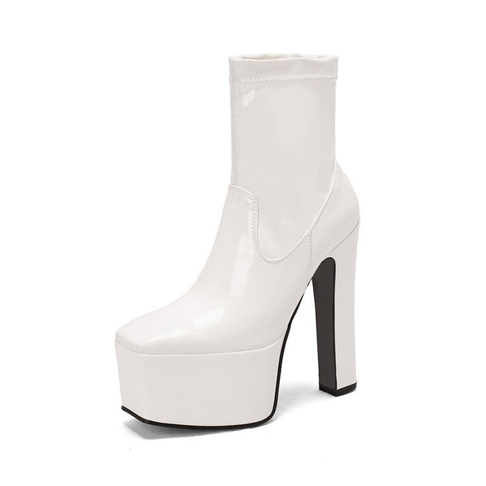 White women's platform ankle boots with a sleek design and high block heels for stylish outfits
