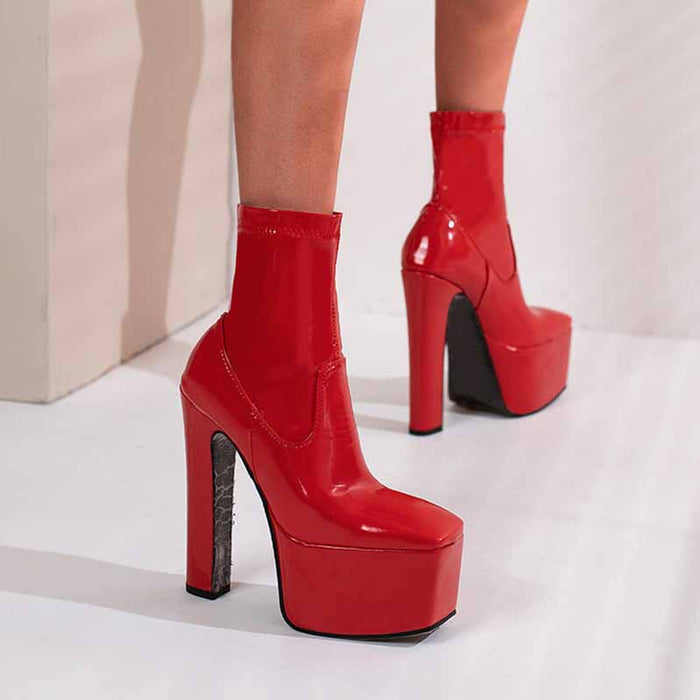 Stylish red women's platform ankle boots with high heels and sleek design