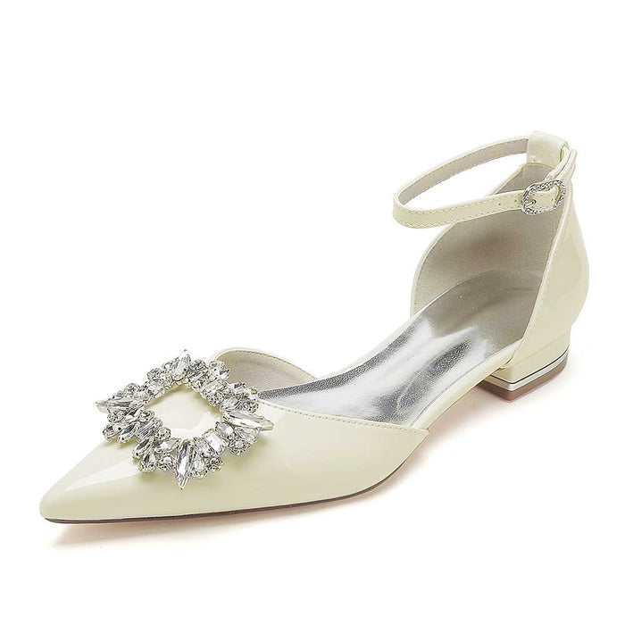 Beaded bridal flats with ankle strap featuring elegant embellishments and a chic pointed toe