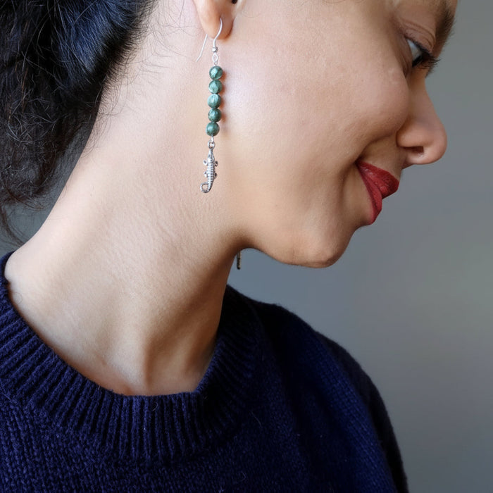 model wearing seraphinite alligator earrings