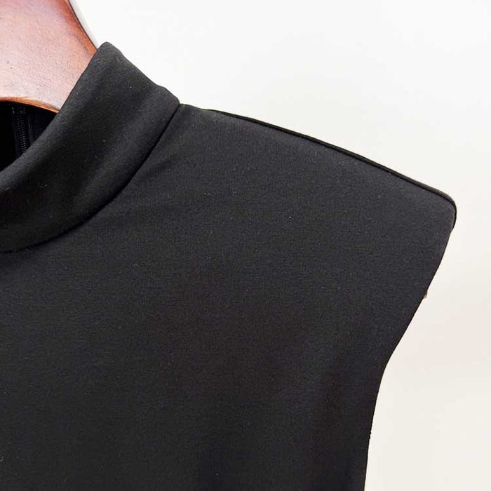 Close-up of the neckline detail on a sleeveless long sheath evening dress in elegant black