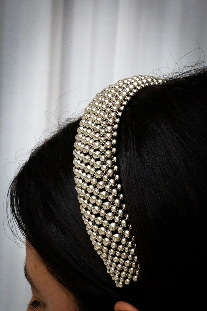 Object & Dawn Teuta Headband silver detail view worn by woman in neutral background