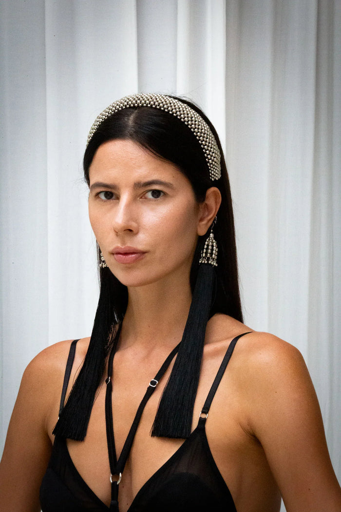 Object & Dawn Teuta Headband silver front view worn by woman smile in neutral background