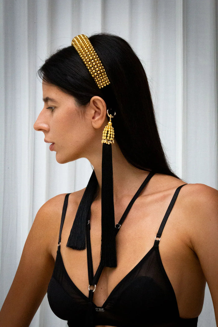 Woman in black outfit wear gold beaded Teuta Headband by Object & Dawn in netural background