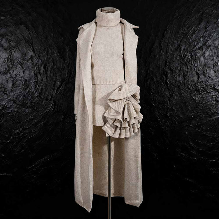Elegant three piece women's sweater set featuring a turtleneck top, skirt, and long cardigan