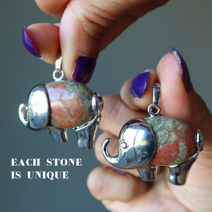holding two Unakite elephant pendants