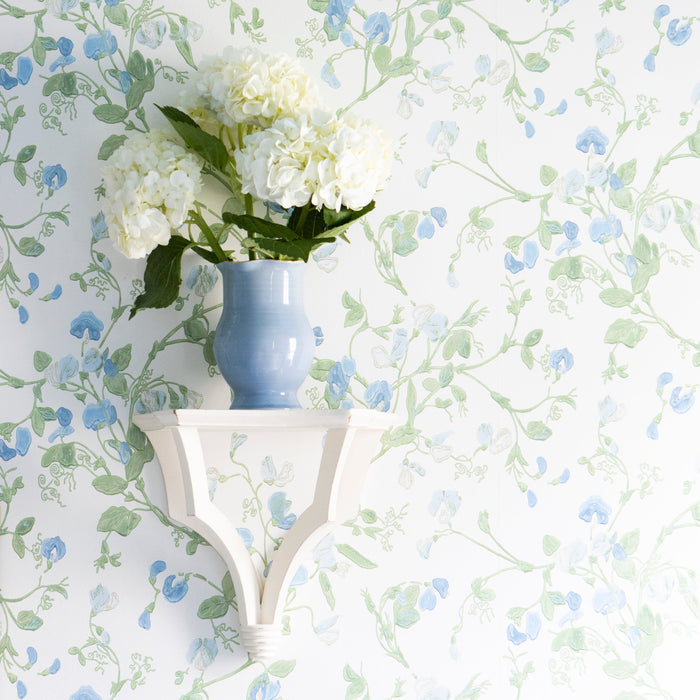 Wavy Amphora Stoneware Vase — Blue vase holding separate flowers on a wall shelf; Susan Gordon Pottery