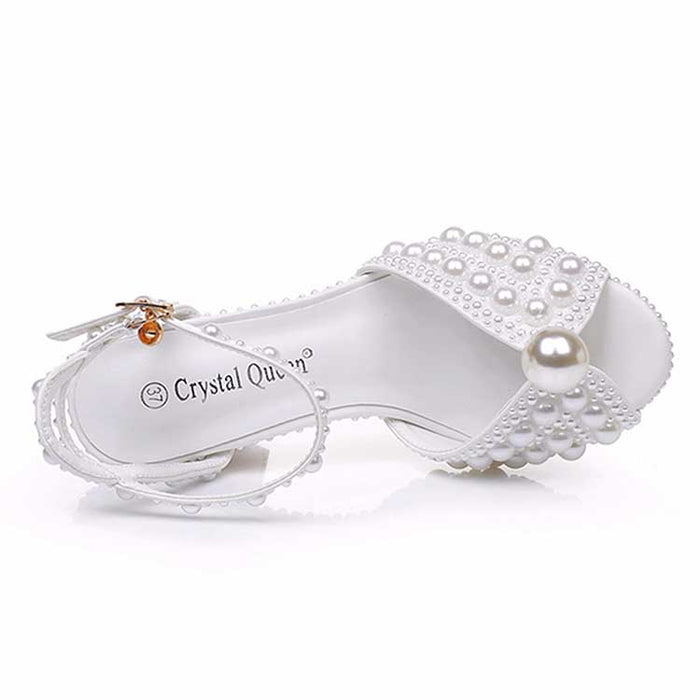 White chunky wedding sandals with pearl embellishments for a stylish bridal look