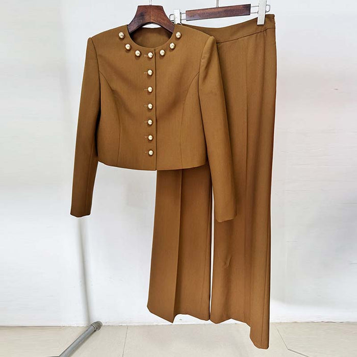 Women's brown tailored pantsuit featuring a cropped jacket with button details and wide-leg pants