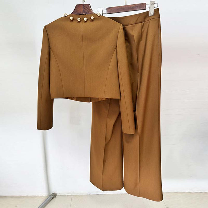Women's brown tailored pantsuit featuring a stylish cropped jacket with decorative buttons