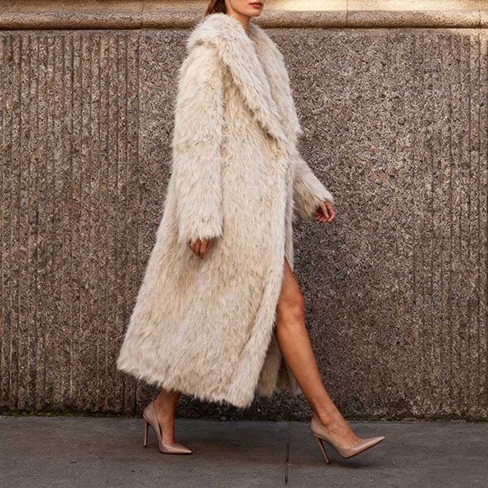 Women's faux fur winter coat long in cream color, stylishly worn for cold weather fashion