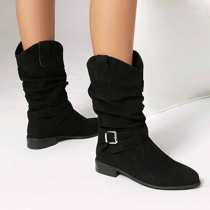 Stylish women's flat suede ankle boots in black with slouchy design and buckle detail