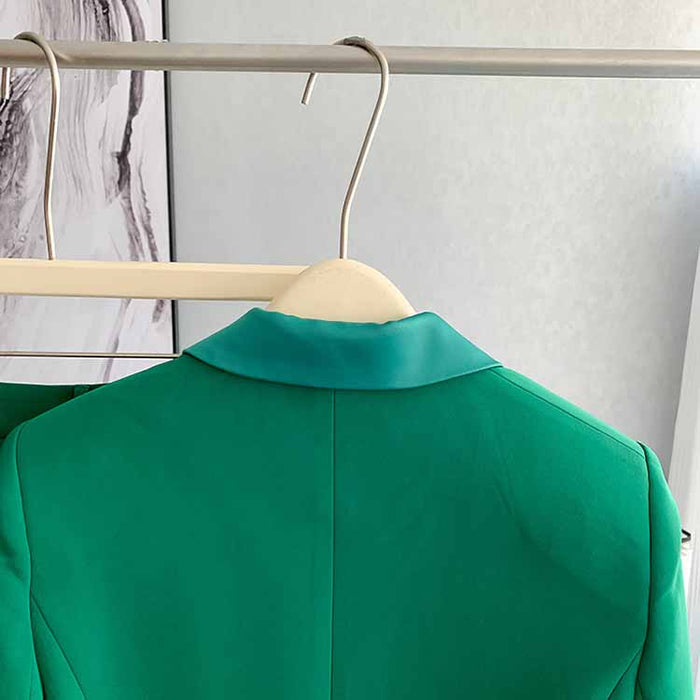 Back view of a stylish women's green pantsuit formal by SD Dresscode & Fashiontrends, ideal for elegant occasions