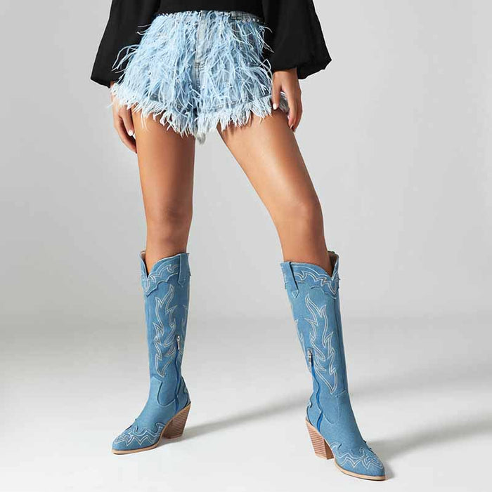 Stylish women's knee high cowboy boots in blue, perfect for a trendy summer outfit with shorts