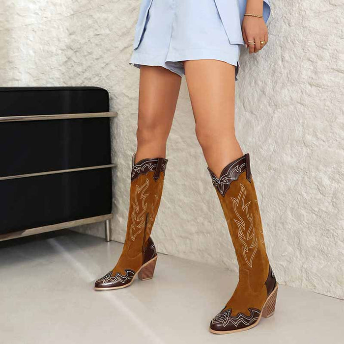 Stylish women's knee high cowboy boots with intricate stitching and a comfortable heel