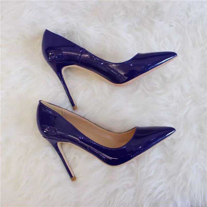 Elegant women's navy high heel pumps with a glossy finish and pointed toe design