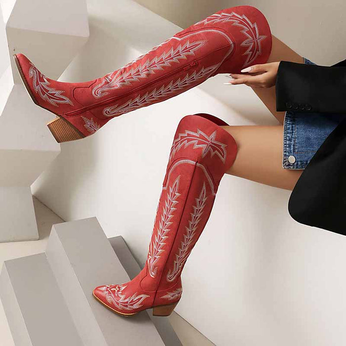 Red women's over the knee cowboy boots with white stitching and a stylish design
