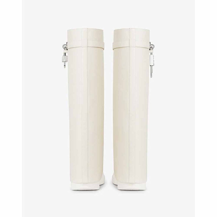 Women's padlock knee high boots in white with a sleek design and secure lock feature