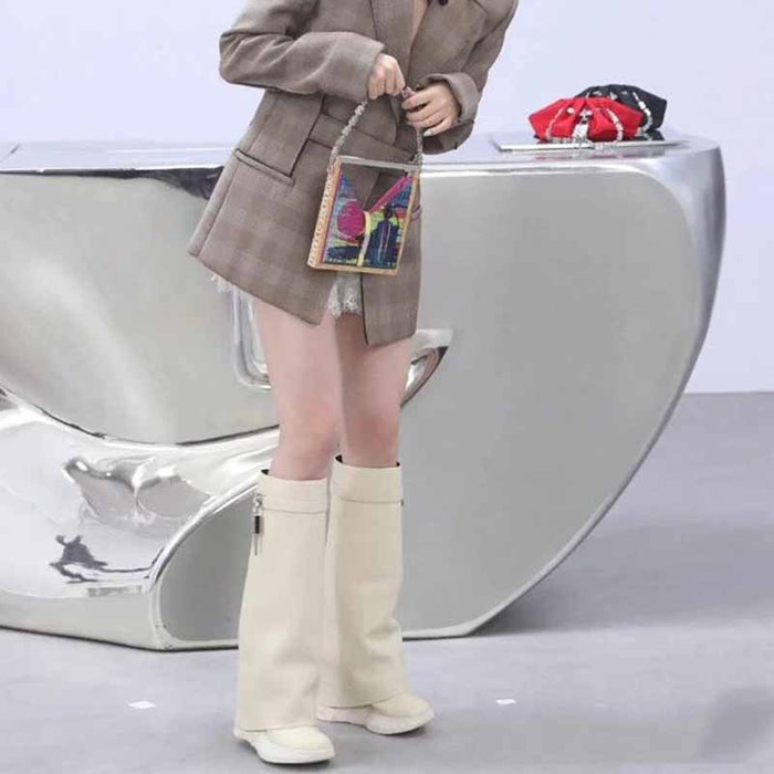 Stylish woman's outfit featuring women's padlock knee high boots paired with a blazer