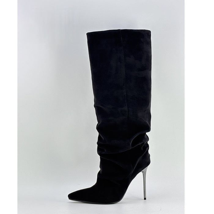 Black knee-high boot with a pointed toe and high heel on a white background