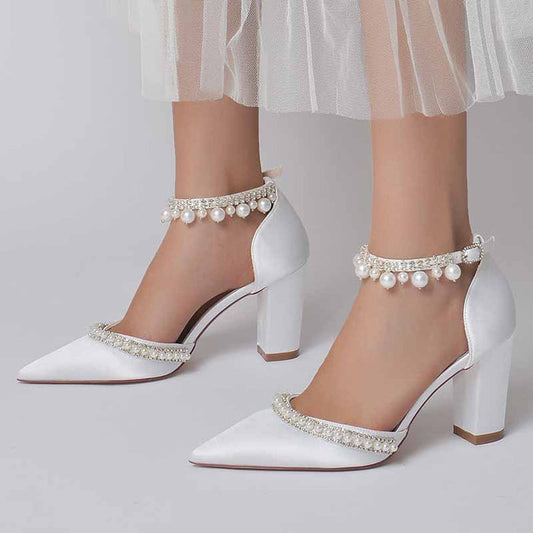 Elegant women's white block heel wedding shoes adorned with pearl details for bridal style
